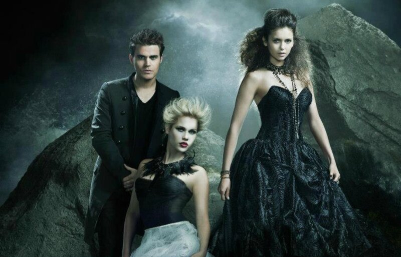 Three People in Dark Clothing — Black, Dramatic, Photograph, Rocks