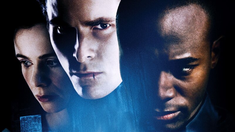 Three People in Dark Light
