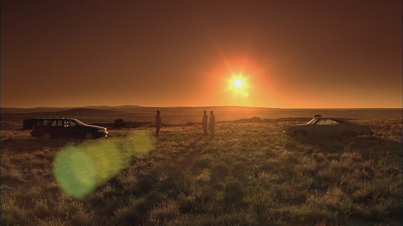 Three People in Field — Orange
