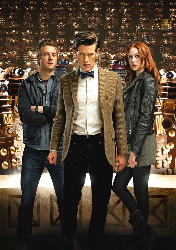 Three People in Front of Robots — Brown