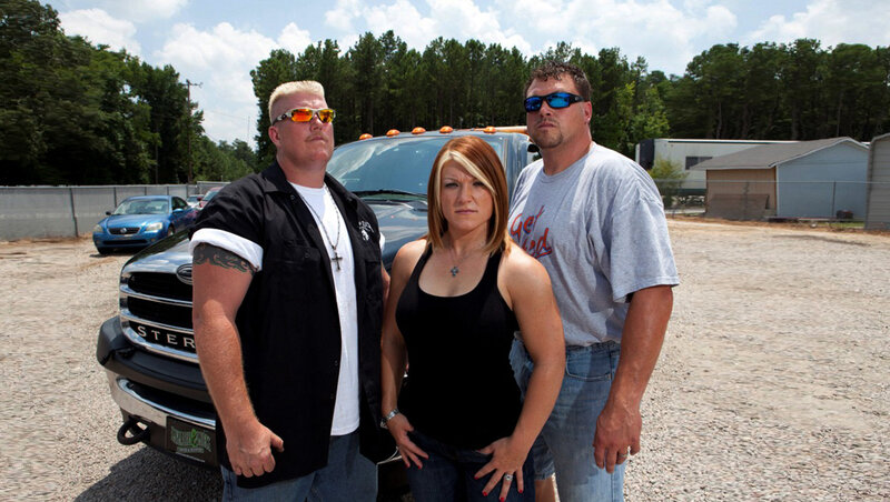 Three People in Front of Truck