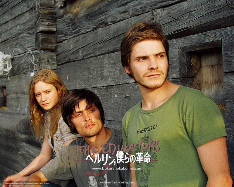 Three People in Front of Wood Wall