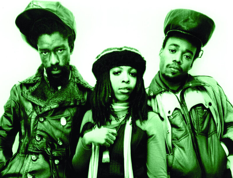 three people in green-tinted photo