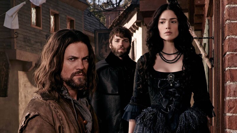 Three People in Period Clothing — Black, Dramatic