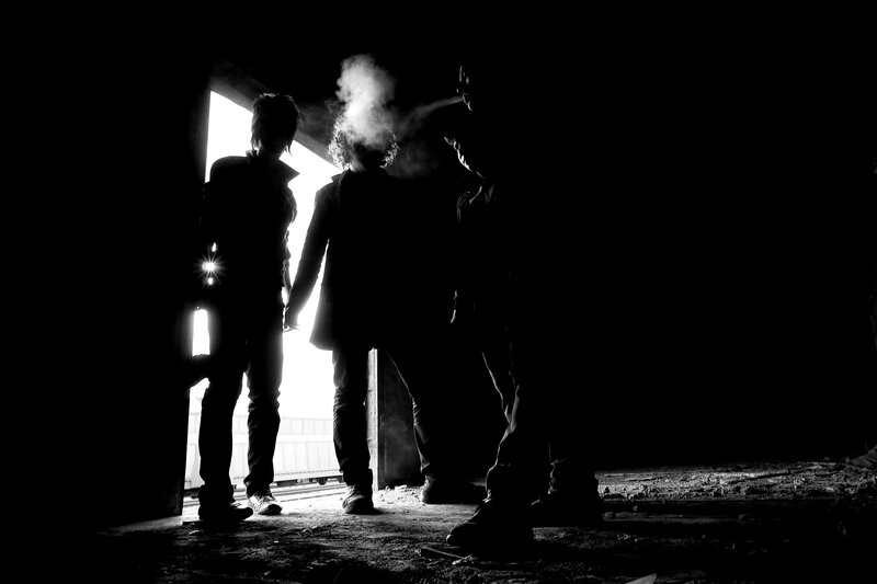 Three People in Silhouette — Black