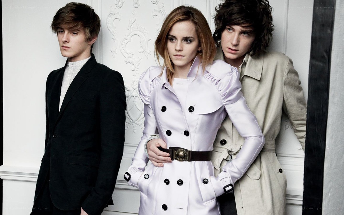 Three people in stylish coats
