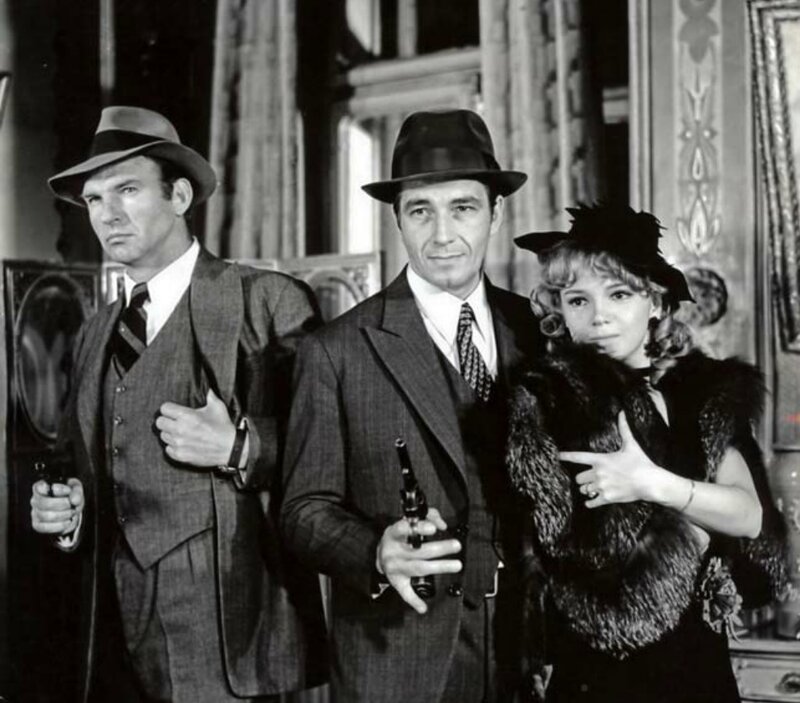 Three People in Suits — Black, Dramatic