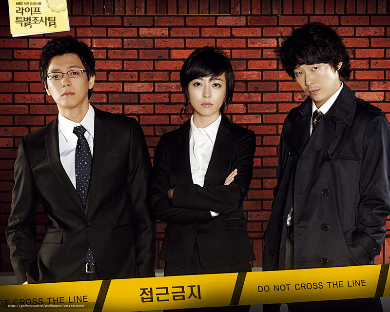 Three People in Suits — Black, Serious