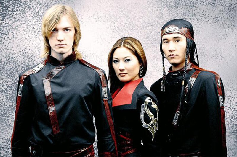 three people in traditional-inspired attire