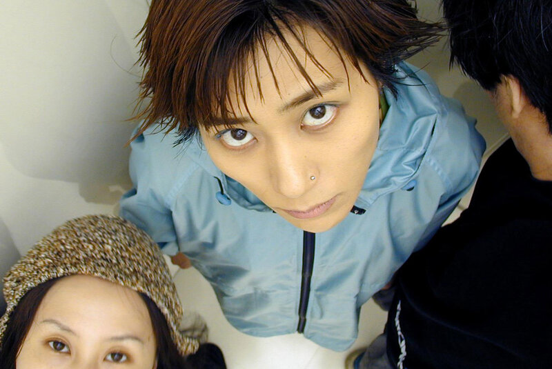 Three people looking up at camera