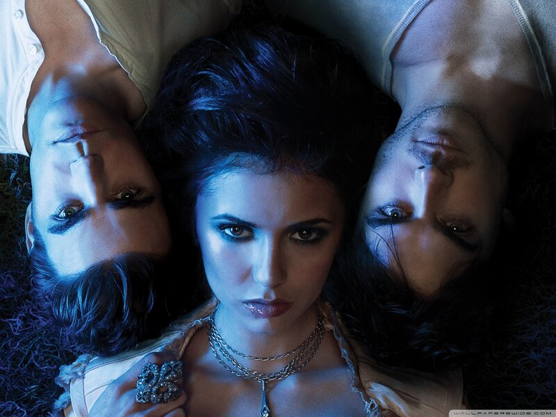 Three People Lying on Grass — Blue, Dramatic, Night, Photograph