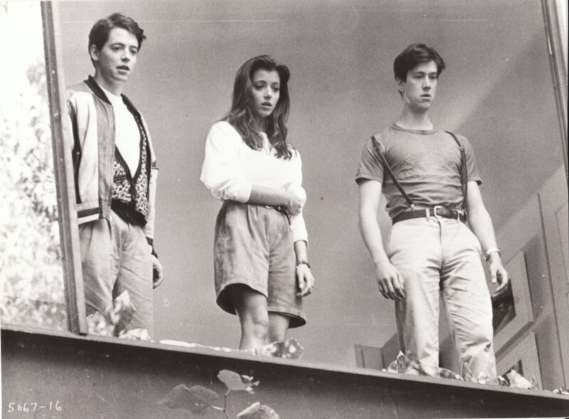 three people on a balcony