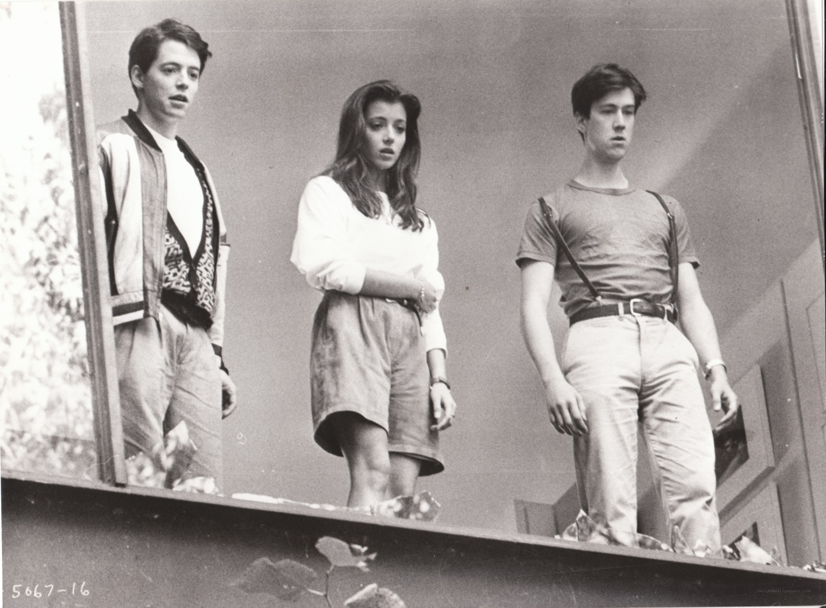 three people on a balcony