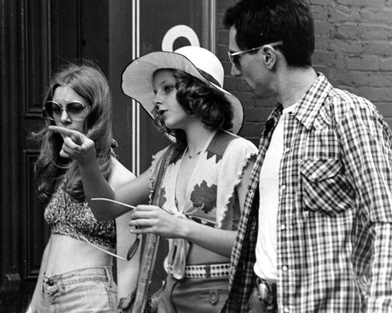 Three people on a city street