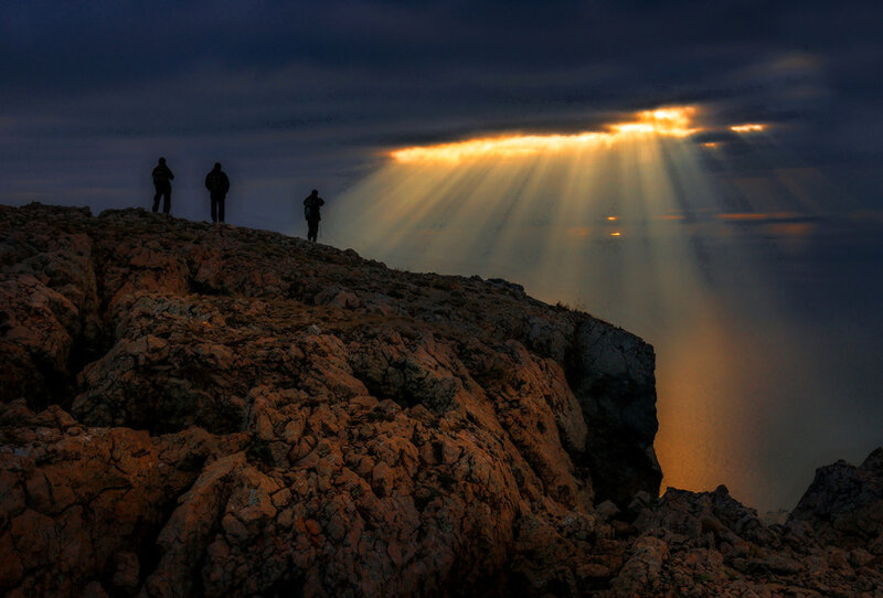 Three People on a Cliff — Orange
