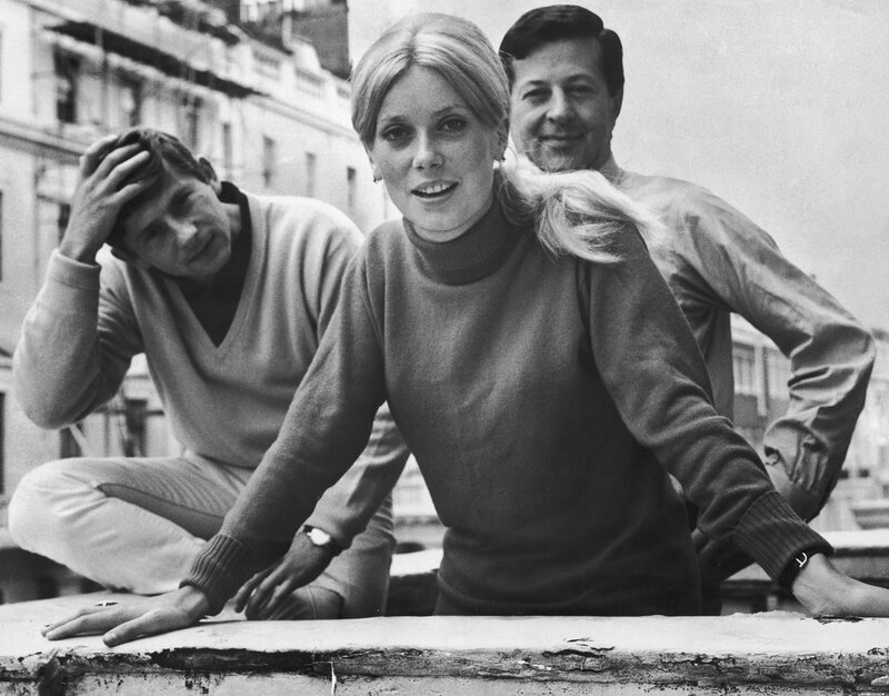 Three people on a rooftop
