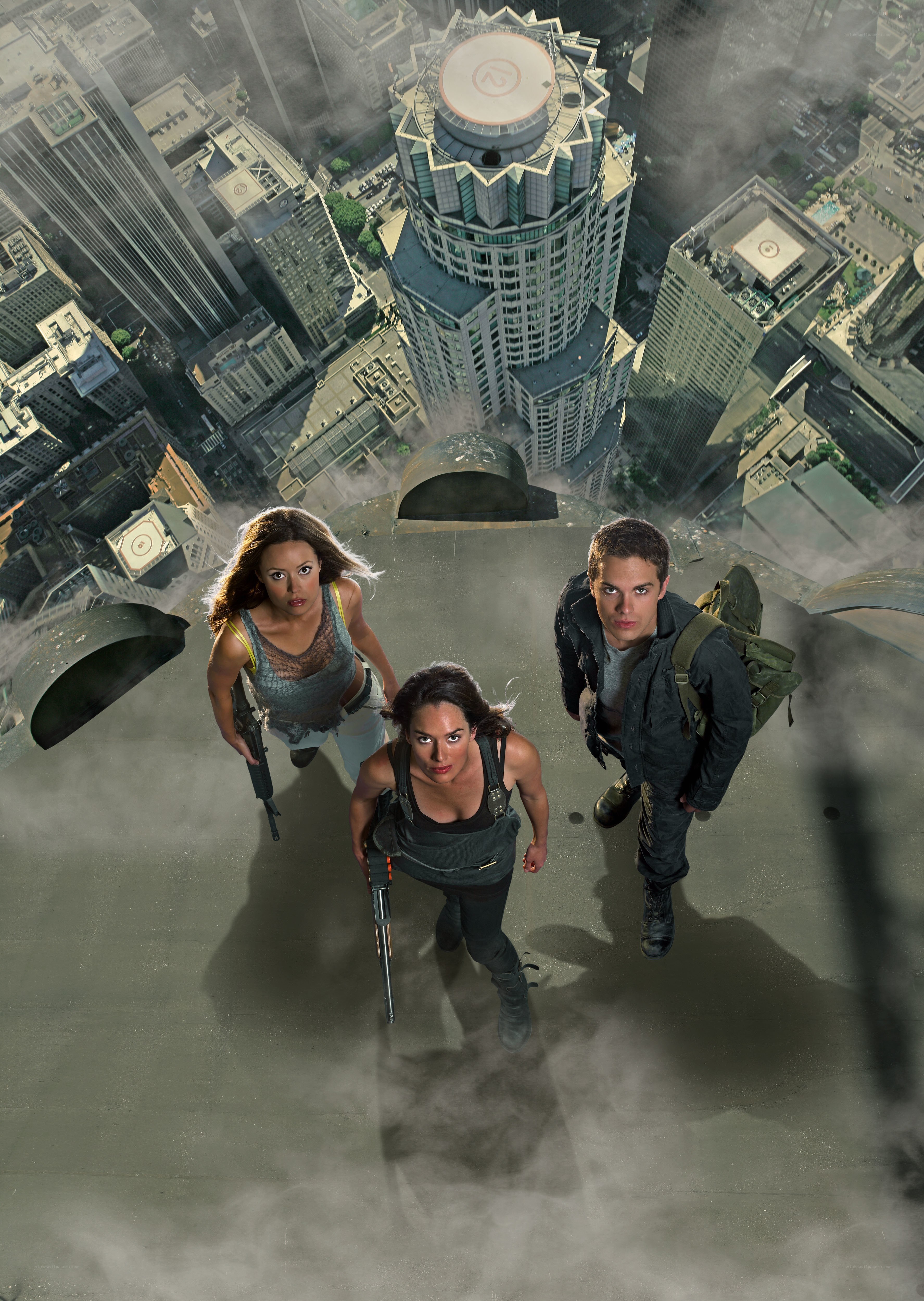 Three people on a skyscraper roof