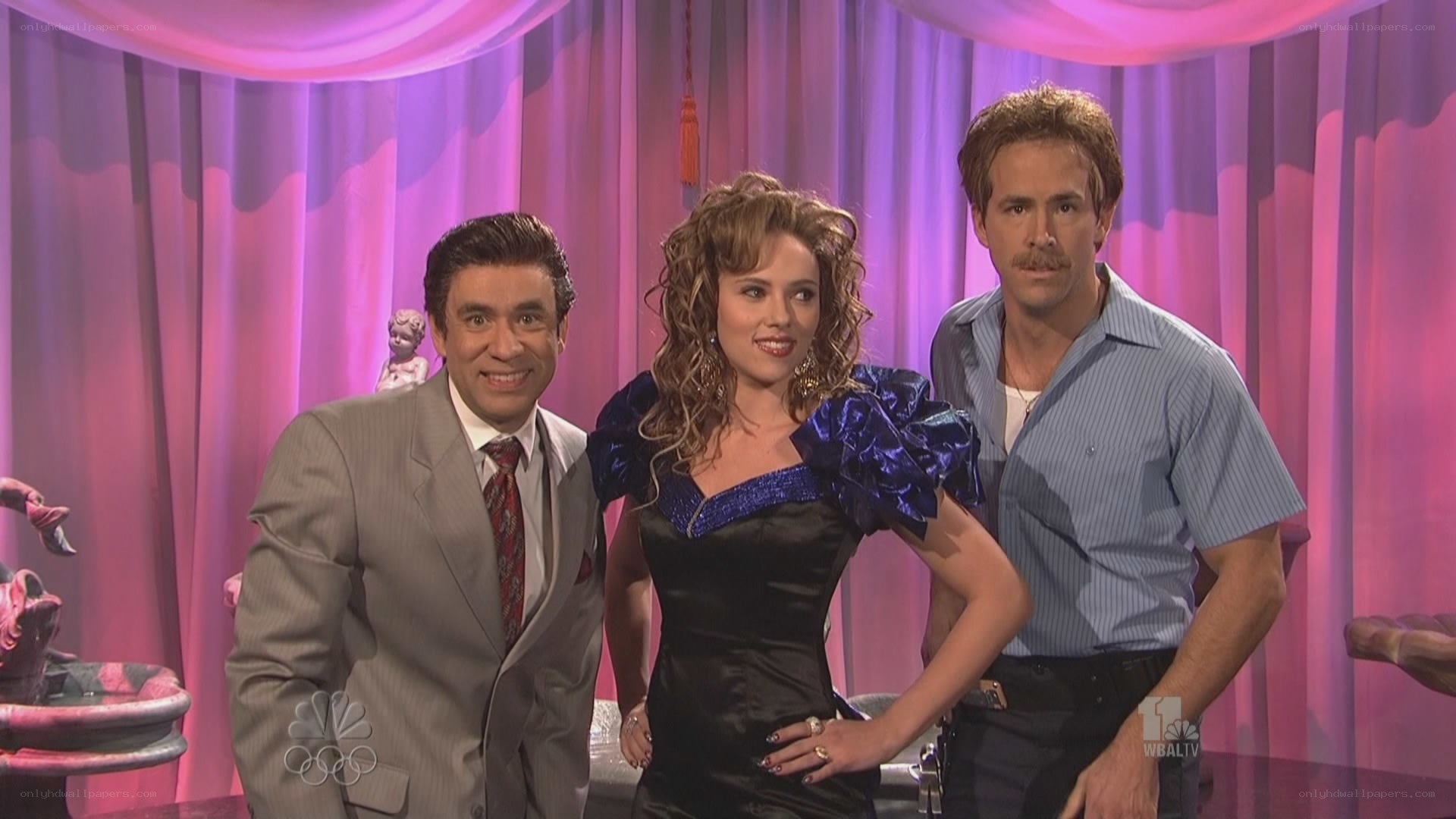 Three people on a stage
