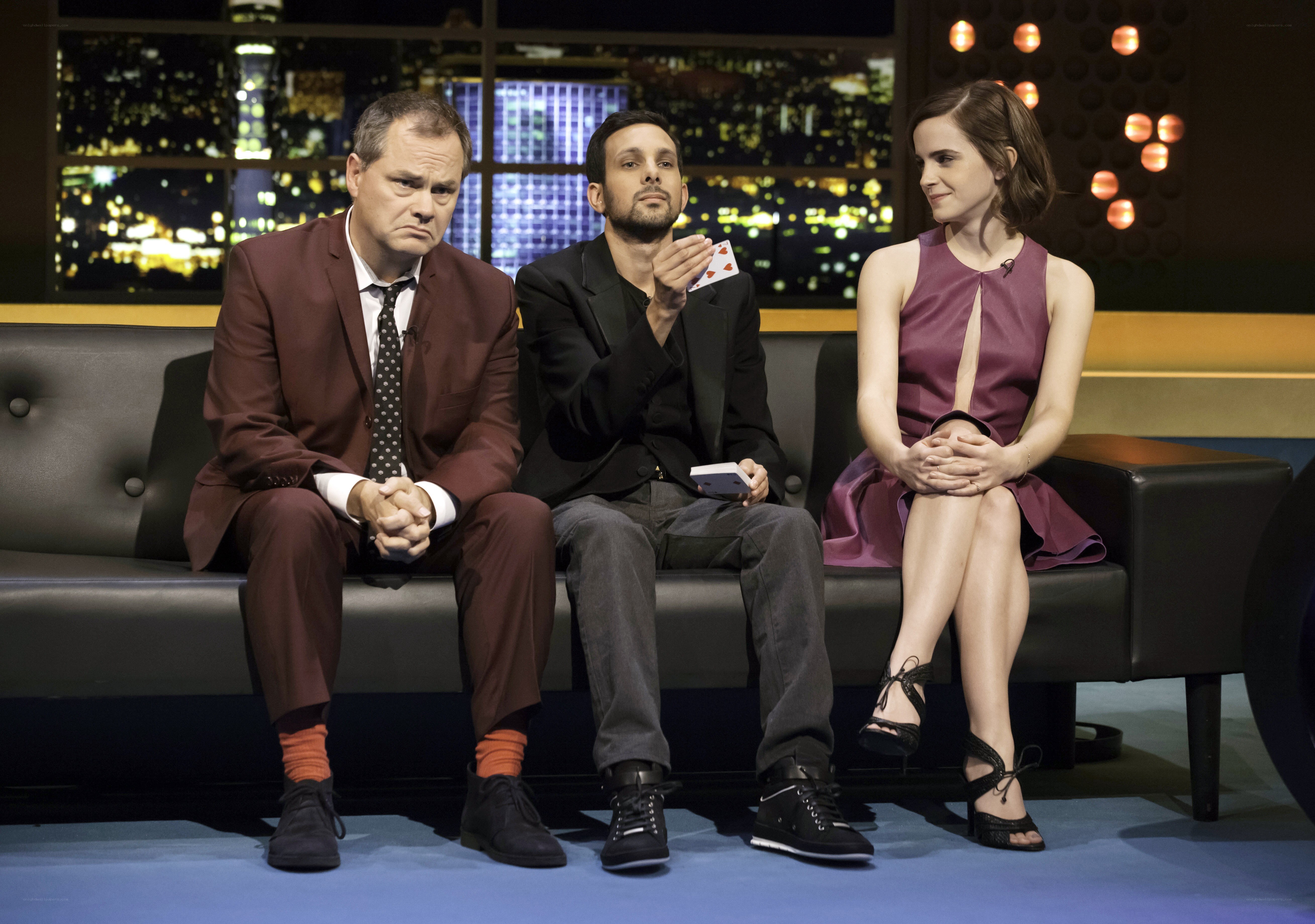 Three people on a talk show set