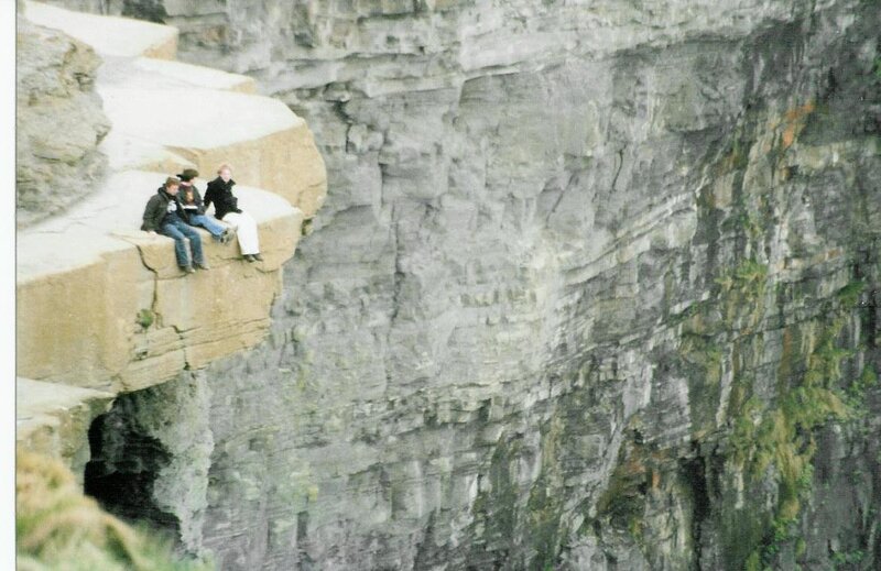 Three People on Cliff Edge