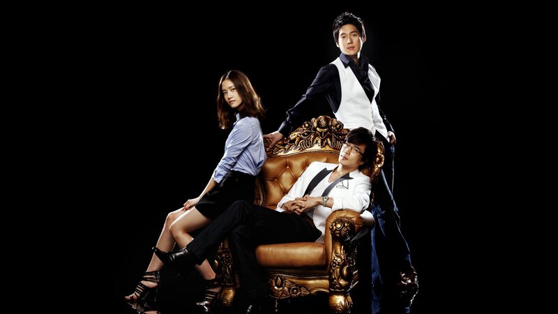 three people on ornate chair