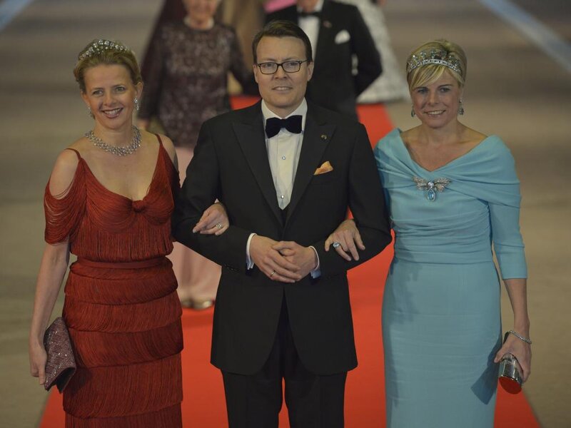Three People on Red Carpet — Formal, Night