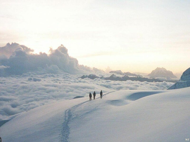 Three People on Snowy Mountain