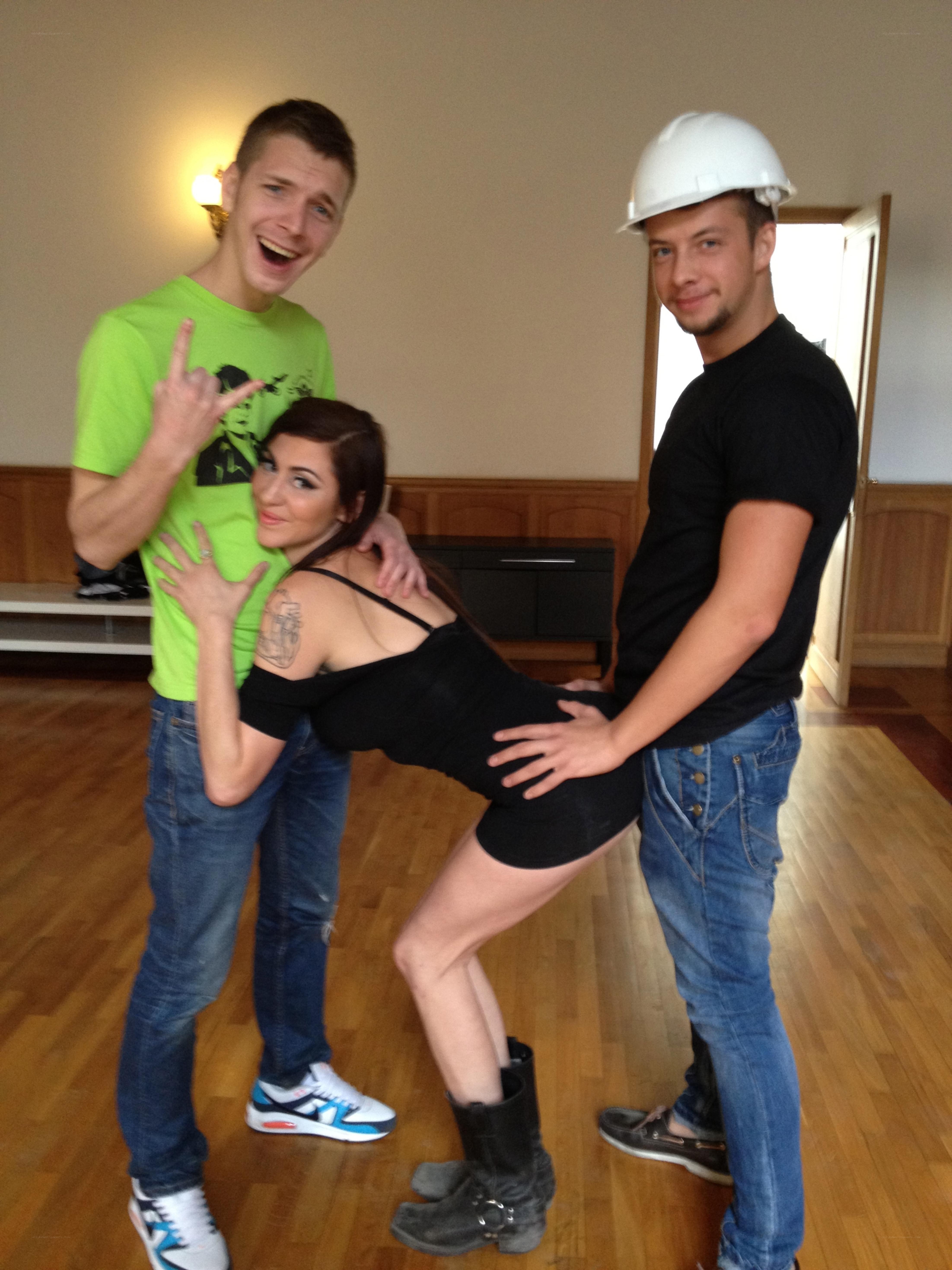 Three people posing playfully