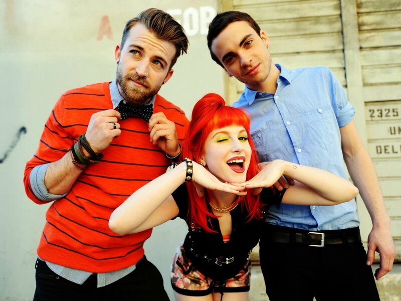 Three People Posing — Red, Playful