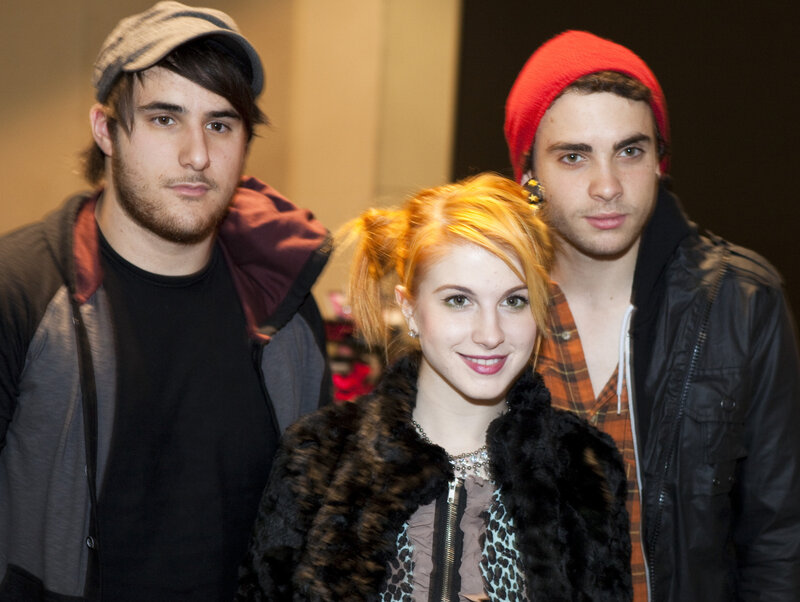 three people posing together