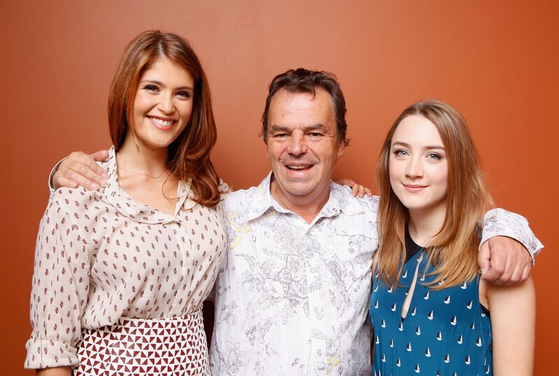 Three People Posing Together — Orange, Friendly