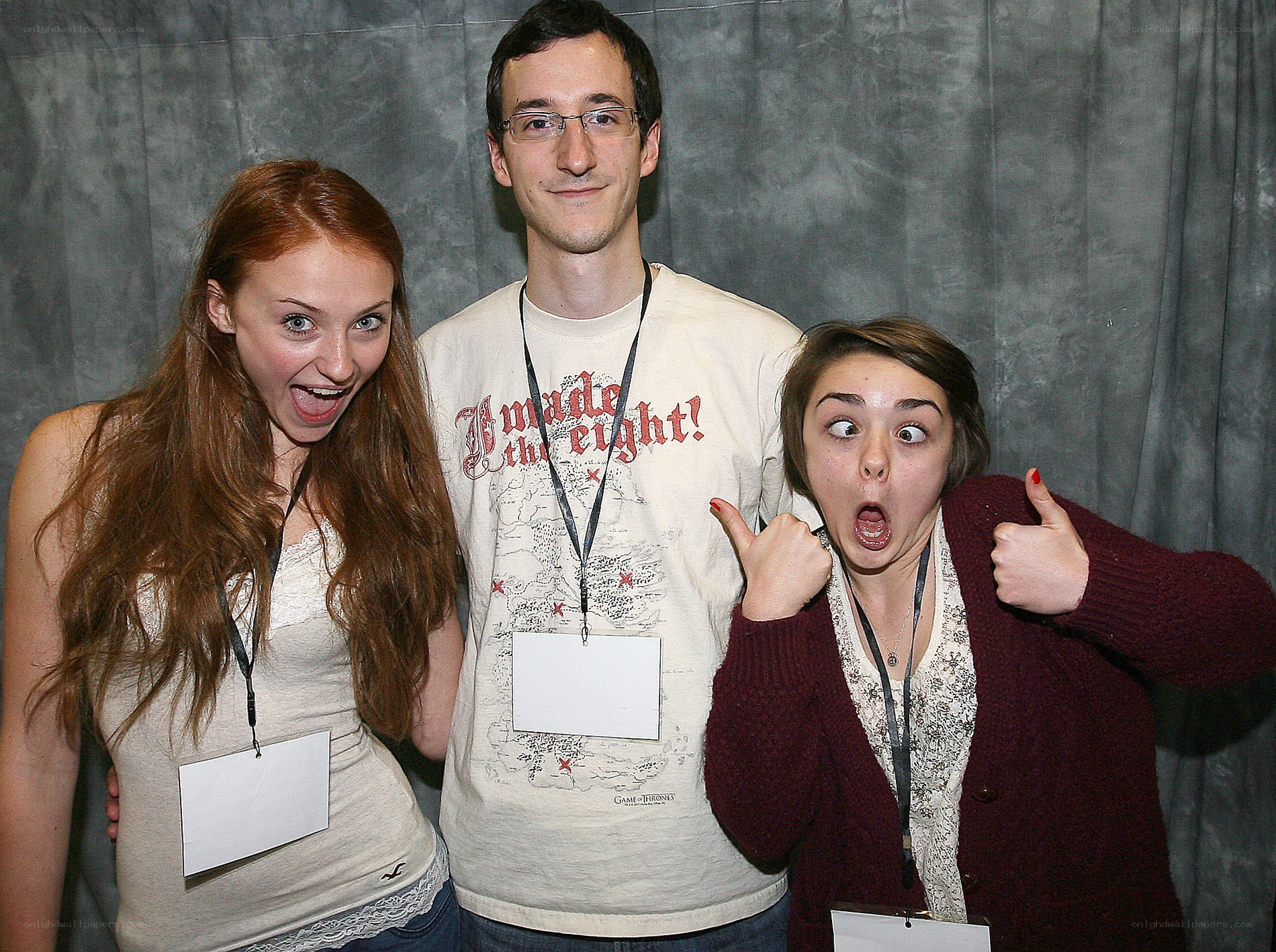 Three people posing with funny faces