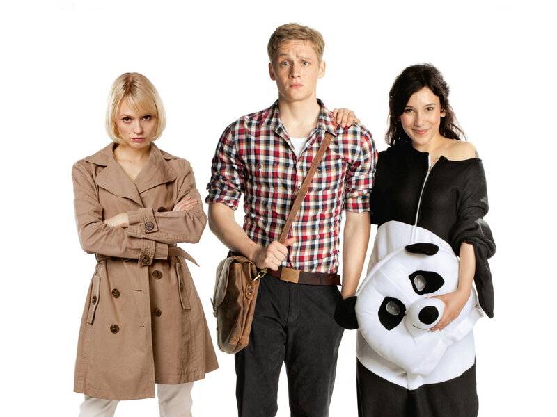 Three people posing with panda bag
