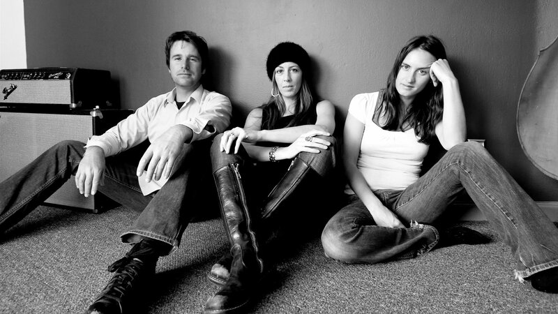 Three People Sitting on Floor