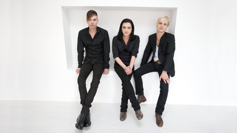 Three People Sitting — White