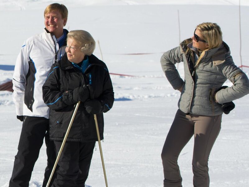 Three People Skiing
