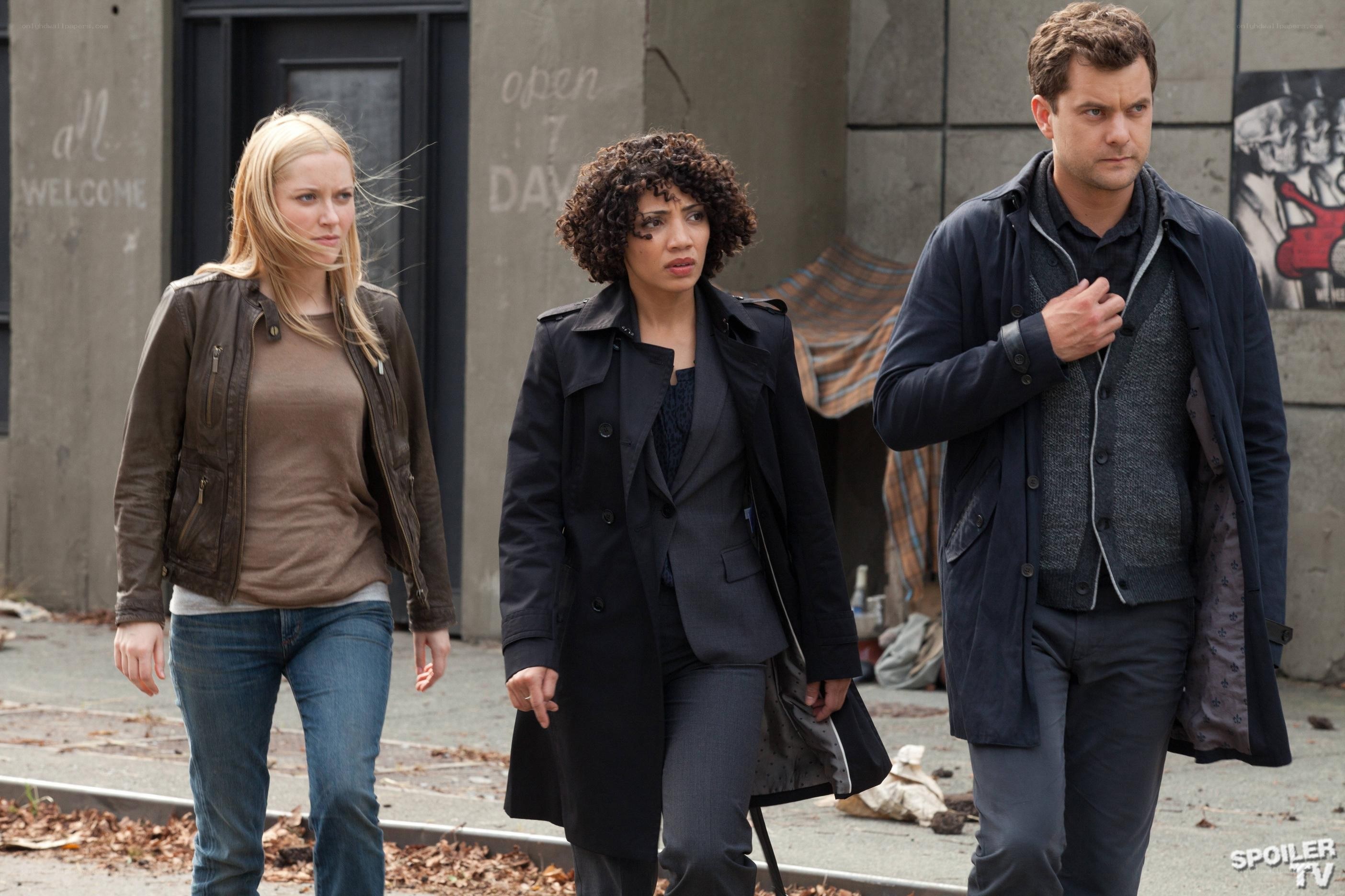 three people walking on street