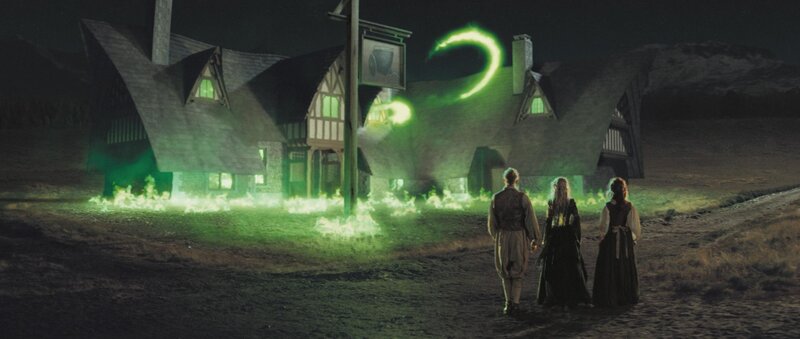 three people watch green magic