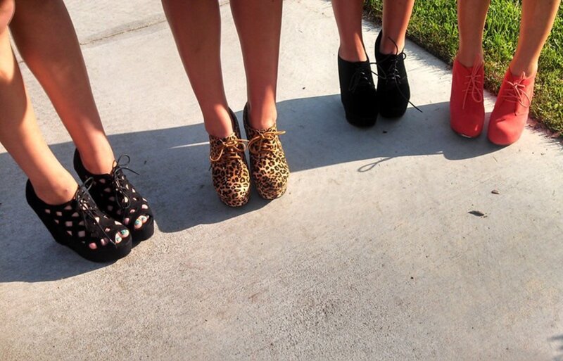 Three People Wearing Shoes