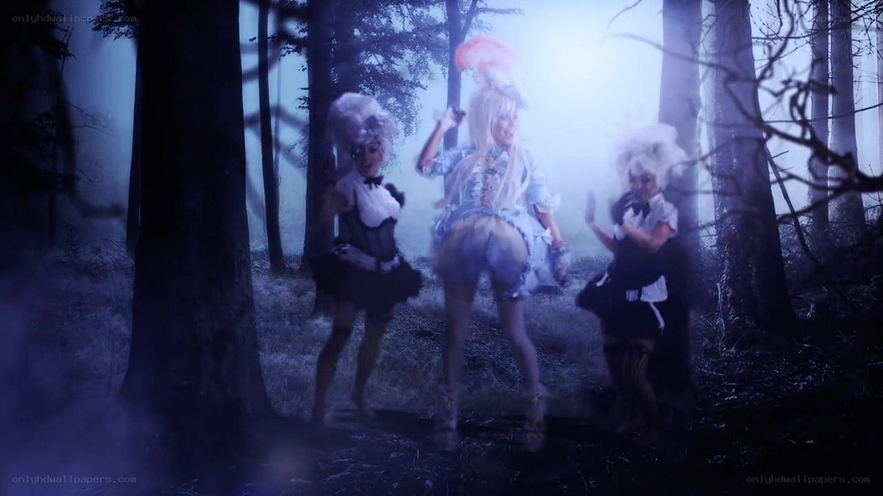 Three performers in a forest