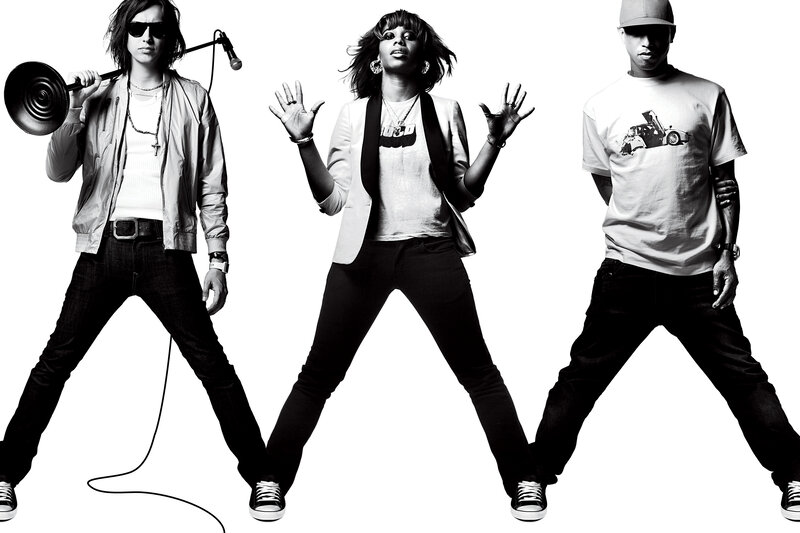 three performers in black and white