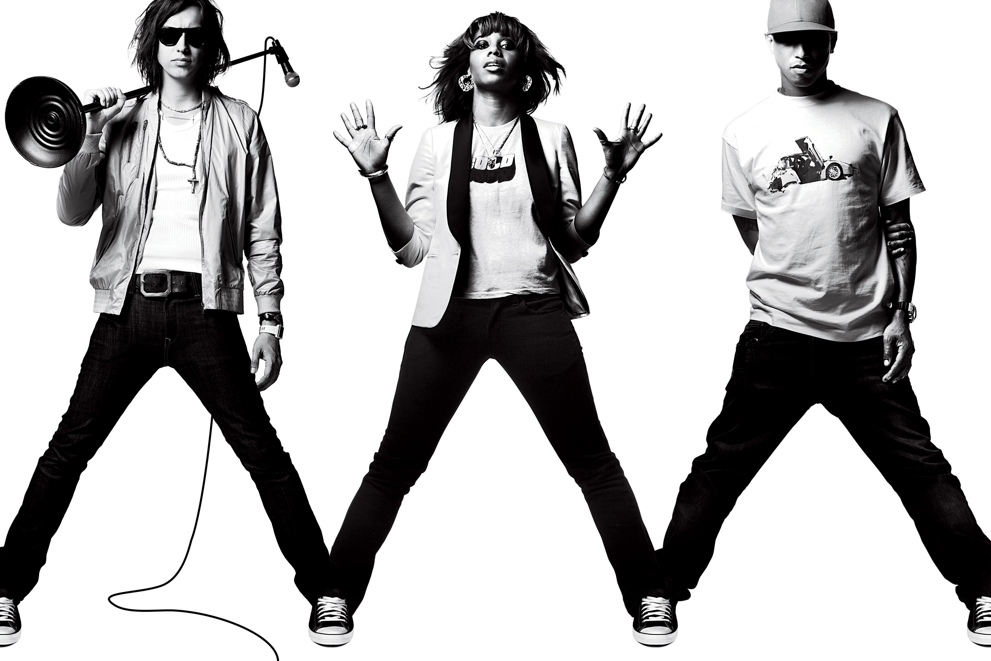 three performers in black and white
