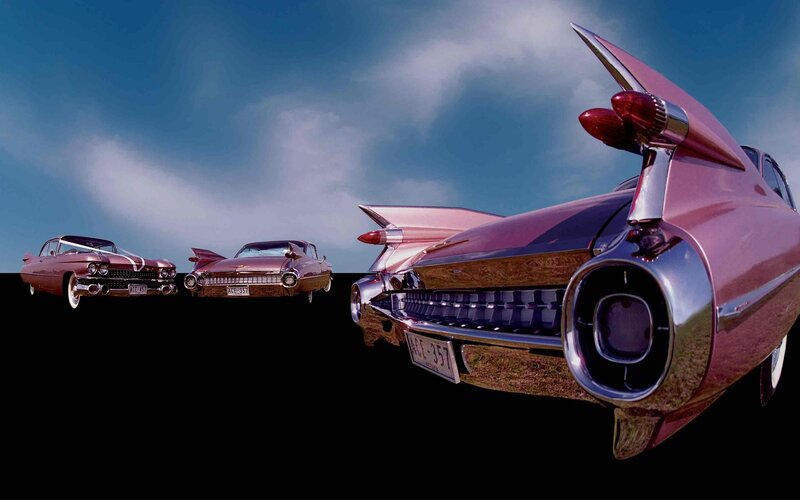 Three Pink Cadillac Cars