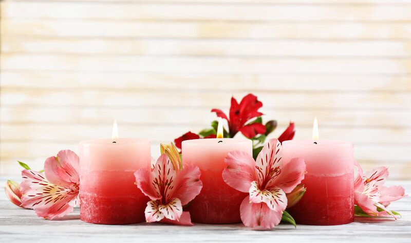 Three Pink Candles with Flowers