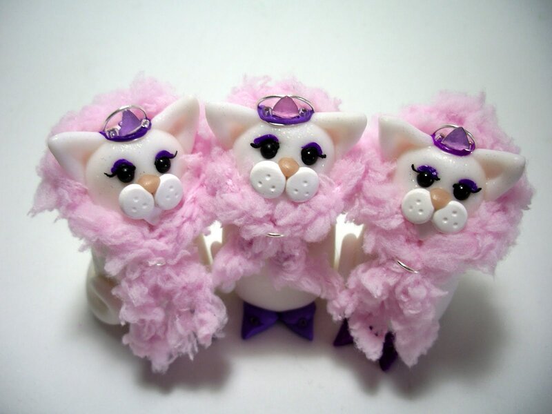 Three Pink Cat Figurines
