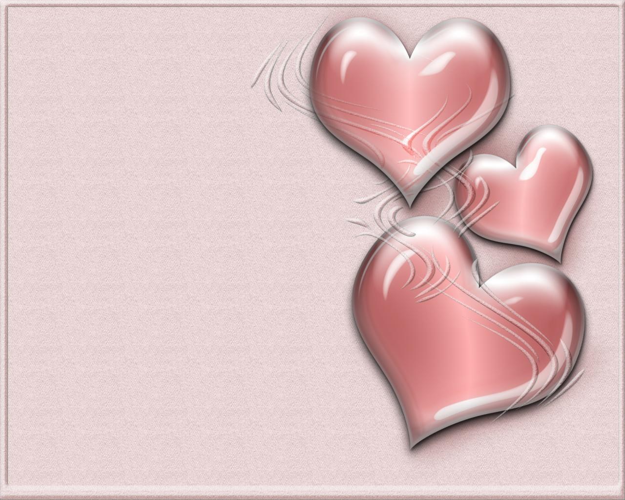three pink hearts on textured background