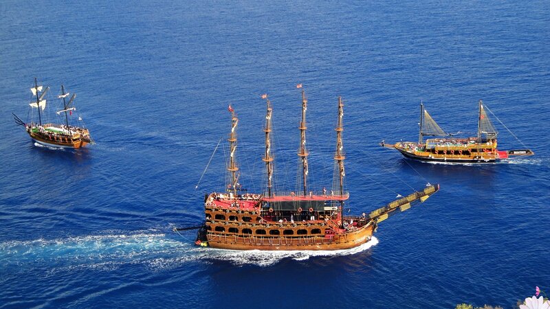 Three Pirate Ships at Sea