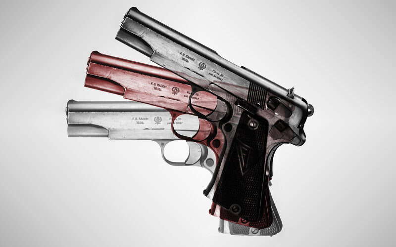 Three pistols in layered composition