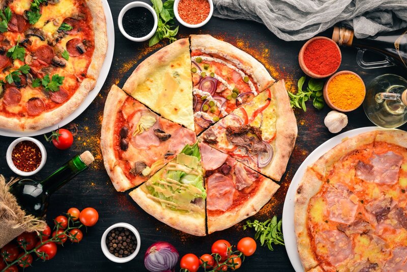 Three Pizzas on Table — Black