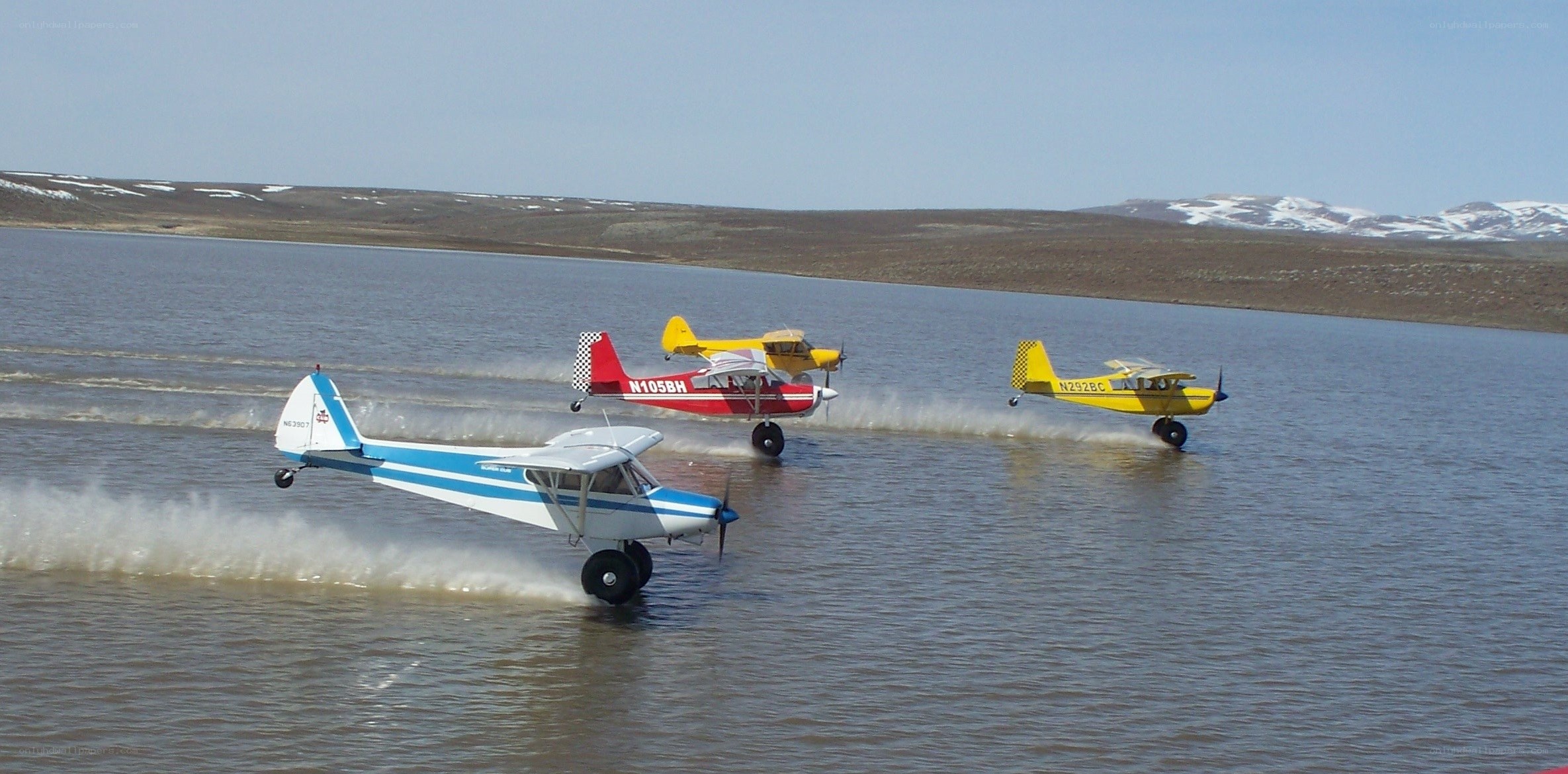 Three planes on water